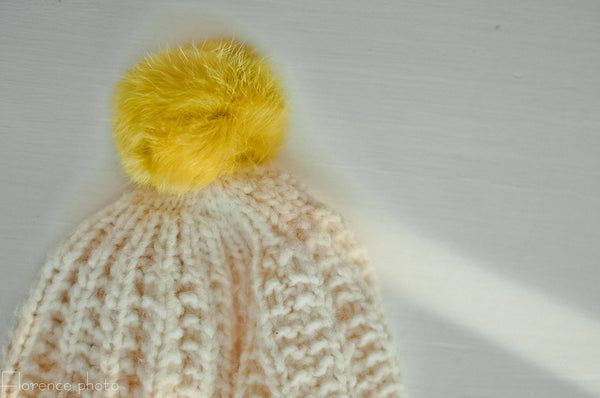 yellow fur pom pom hat