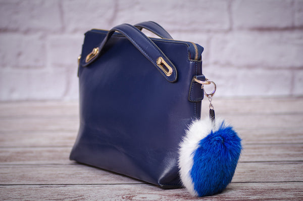 white and blue keychain in fur